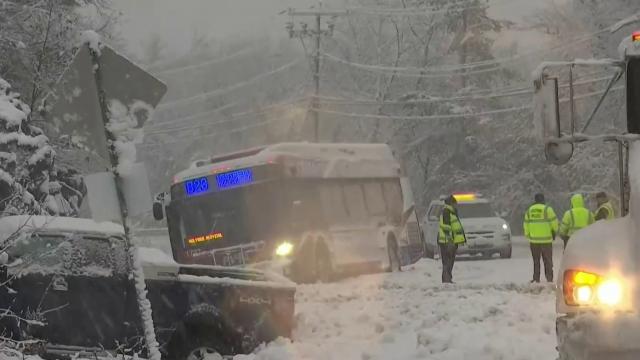 Widespread power outages reported as feet of snow fall in the Northeast